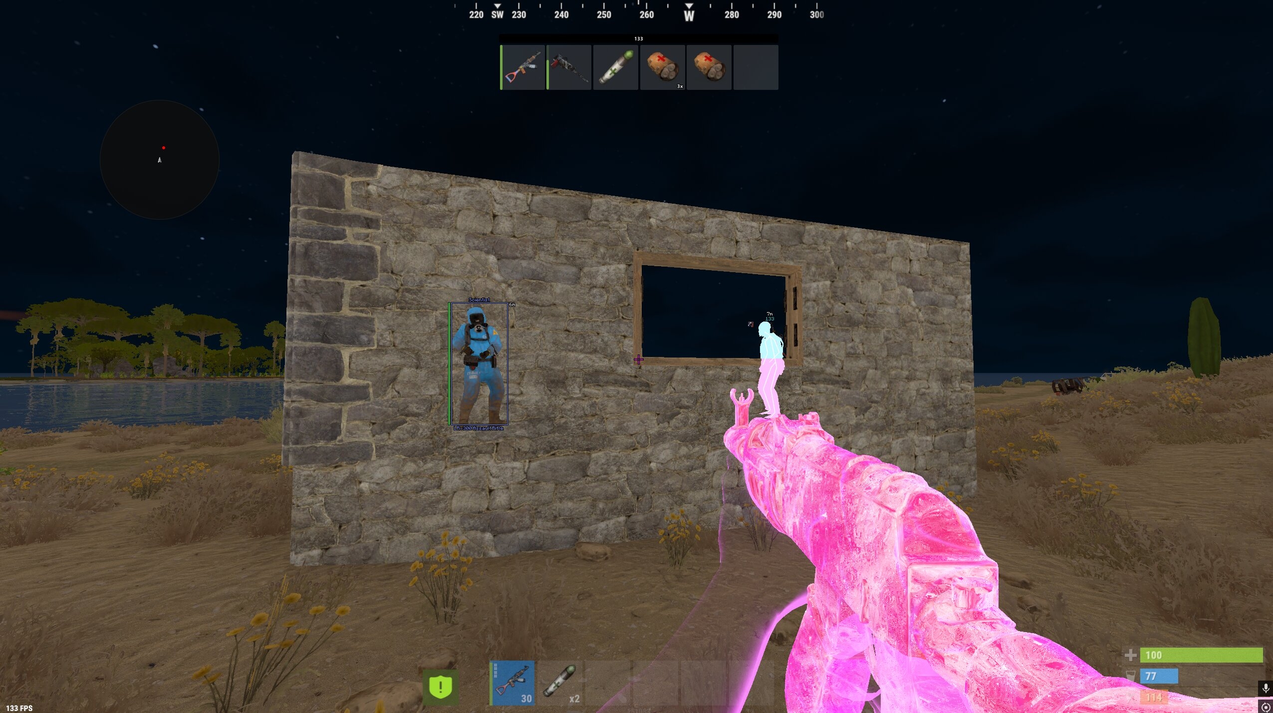 Rust wallhack and player chams visible around a stone base at night